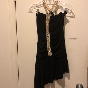 Black halter dress with asemtrecyical hem